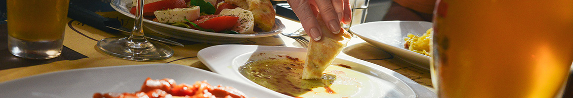 Eating Greek Mediterranean at Kuzina restaurant in Staten Island, NY.